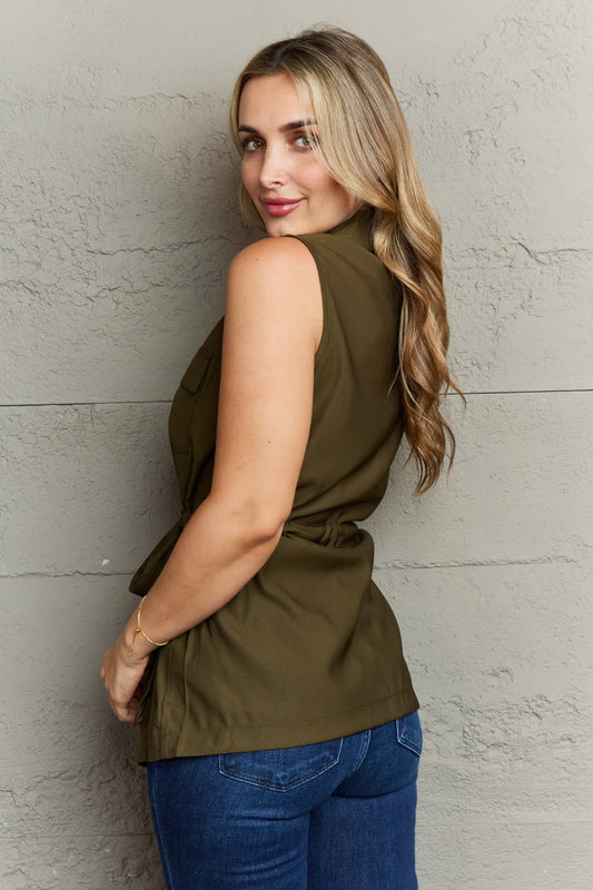 The Light Sleeveless Collared Button Down Top